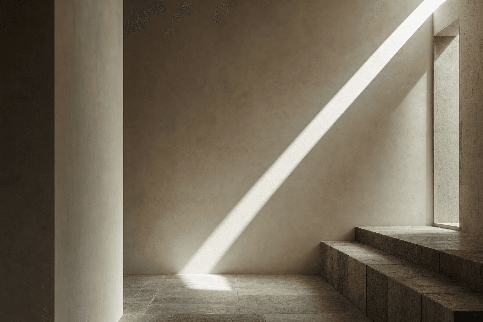 Soft directional light crossing a quiet stone interior